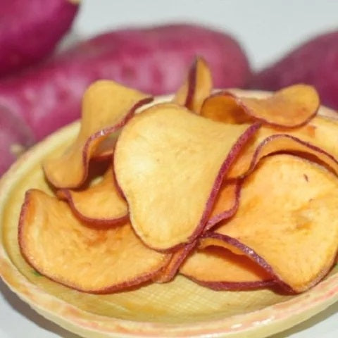Bowl of crispy sugarless sweet potato chips made from aged Naruto Kintoki, deep-fried in rice oil for natural sweetness.