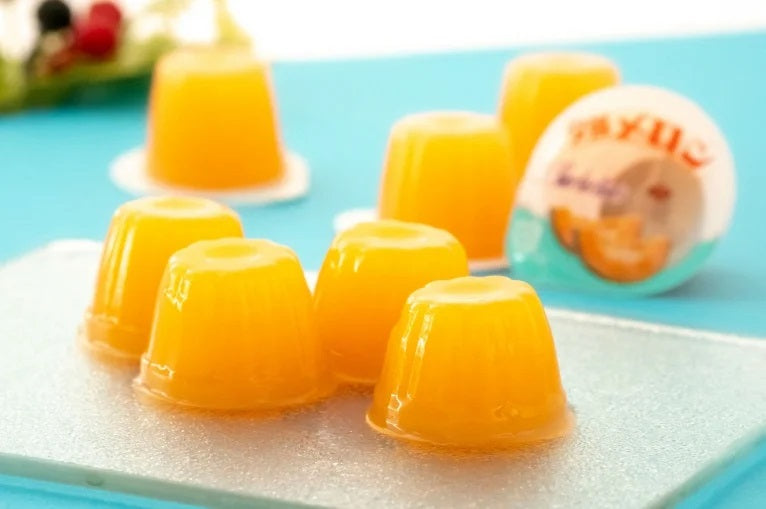 Hokkaido Yubari melon jelly mini cups on a tray, perfect for home use or as a Hokkaido souvenir, dairy allergen aware.