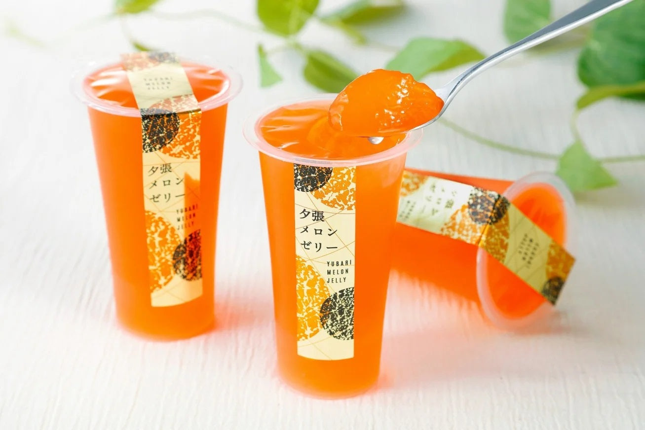 Yubari Melon Jelly Set 2P with rich melon flavor and pulpy texture, elegantly packaged for a luxurious dessert experience.