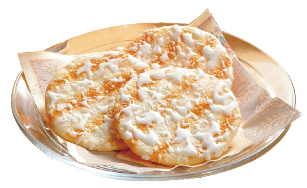 Yuki no Yado Salad Rice Crackers on a plate with milk cream icing, made with fresh Hokkaido cream.