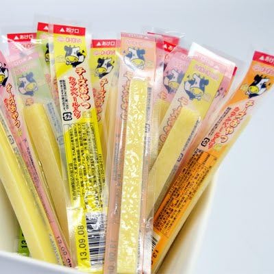 Cheese Oyatsu Long 20P snacks with Camembert cheese and fish paste, packaged individually. Allergen info: Dairy, Wheat, Soybean, Fish.