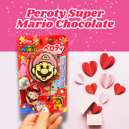 Peroty Super Mario chocolate with colorful packaging alongside paper heart decorations on a pink background.