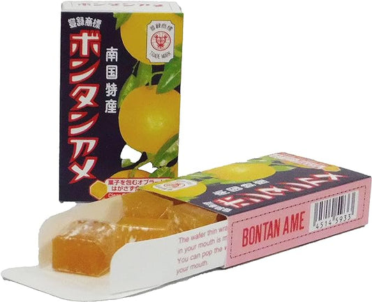 Bontan Ame soft fruit candy packaging with opened candy showing sticky texture, featuring refreshing bontan flavor. Contains allergens: soybean, orange.
