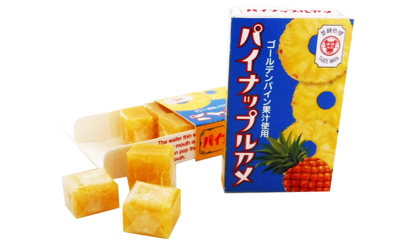 SEIKA FOODS Soft Fruit Rice Candy with pineapple flavor, featuring golden pineapple juice. Contains soybean. Box and candy pieces shown.