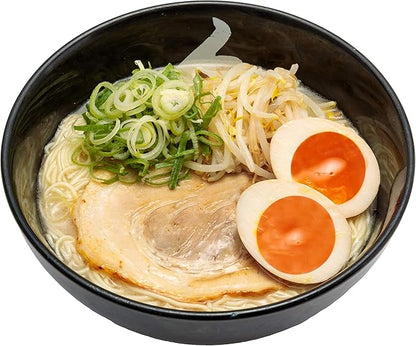 Hakata Ramen Hidechan Tonkotsu with pork slice, green onions, sprouts, and eggs in rich broth by Island Foods.