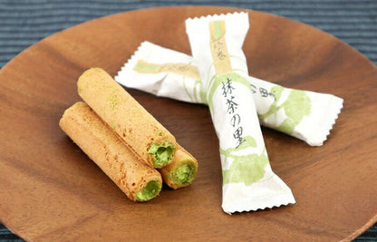 Matcha no Sato cream crackers with luxurious matcha filling on a wooden plate; packaged in elegant wrappers. Allergens: Wheat, Egg, Dairy.
