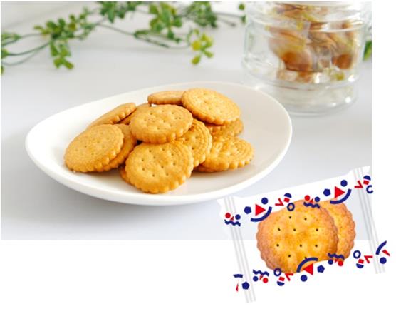 Alt Tag: Plate of Mire Biscuit, an old-fashioned crunchy treat with simple sweetness, alongside packaged biscuits. Contains wheat and soybean.