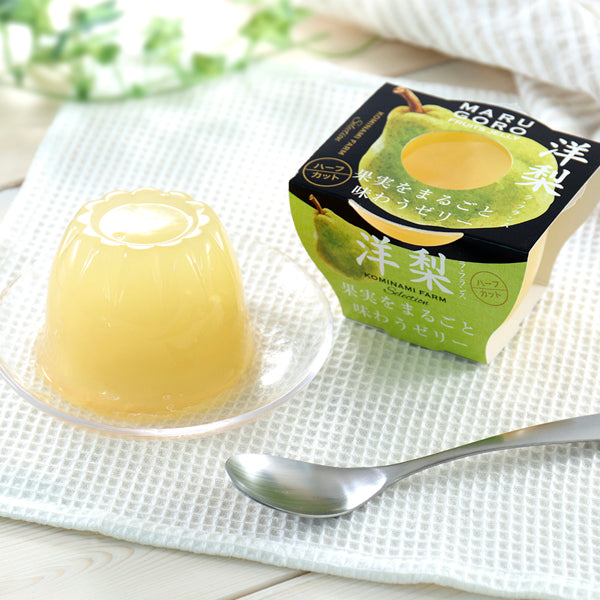 Marugoto pear jelly featuring whole fruit, displayed with box packaging on a white textured cloth, accompanied by a spoon.