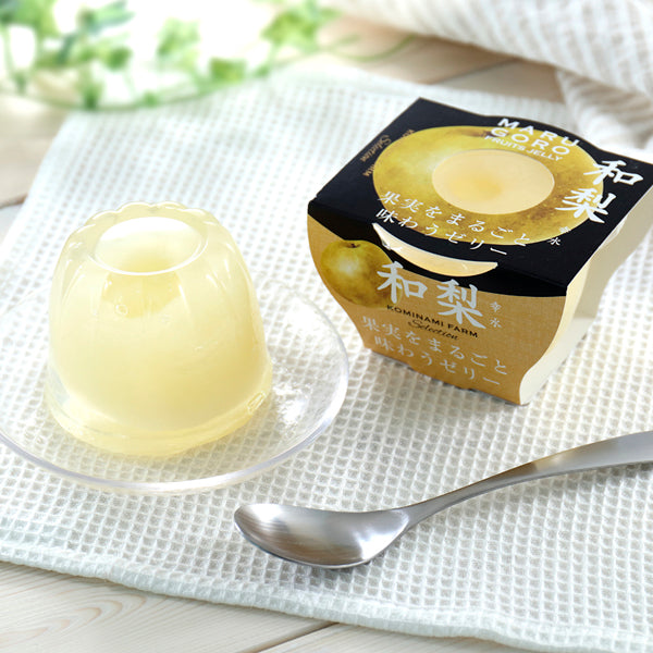 Marugoto Jelly Fruit - Contains Whole Fruits, showcased with a whole fruit encased in peach-flavored jelly on a decorative plate.