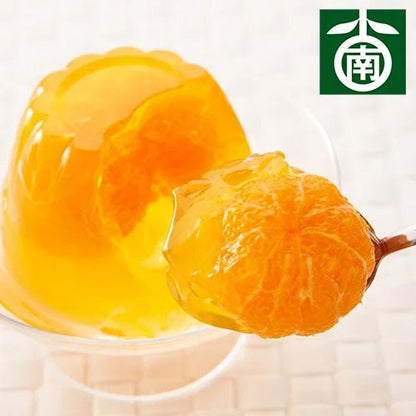 Tamura Mandarin Orange Whole Jelly with visible tangerine fruit in a glass dish, set of 3, showcasing vibrant orange color and sweetness.