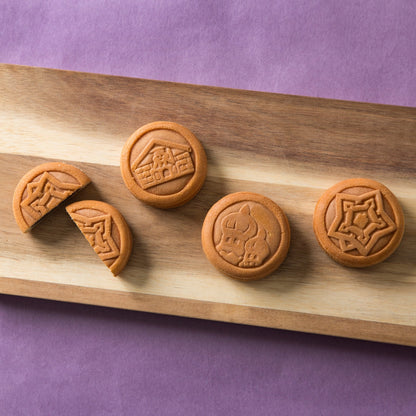 Hakodate Sanpo Castella Manju buns with red bean paste on a wooden board