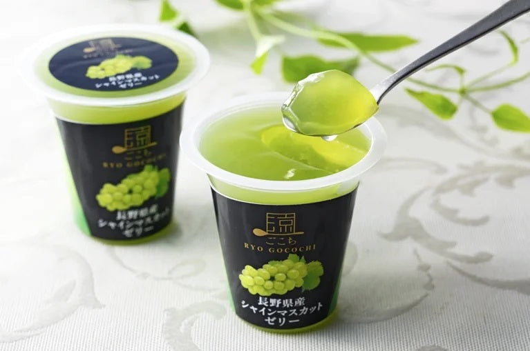 Ryo Gocochi Nagano Shine Muscat Jelly in a cup with a spoon, showcasing the green, juicy texture made from Nagano Shine Muscat grapes.