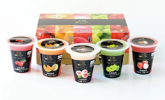Ryo Gocochi Jelly Assortment featuring melons, muscat, peaches, strawberries, cherries in front of colorful packaging box.