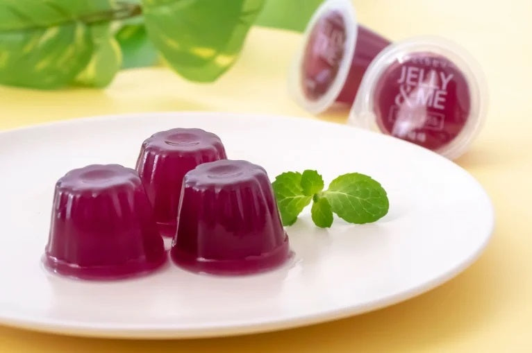 Grape-flavored multi-mineral jellies on a plate, rich in iron, zinc, copper, calcium, and magnesium, with mint garnish.