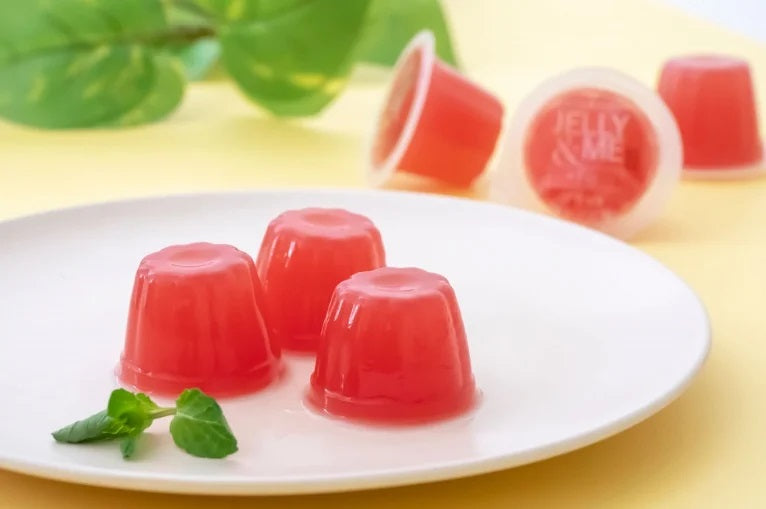 Blood orange jelly cups on a white plate, made with Italian juice for iron deficiency support.
