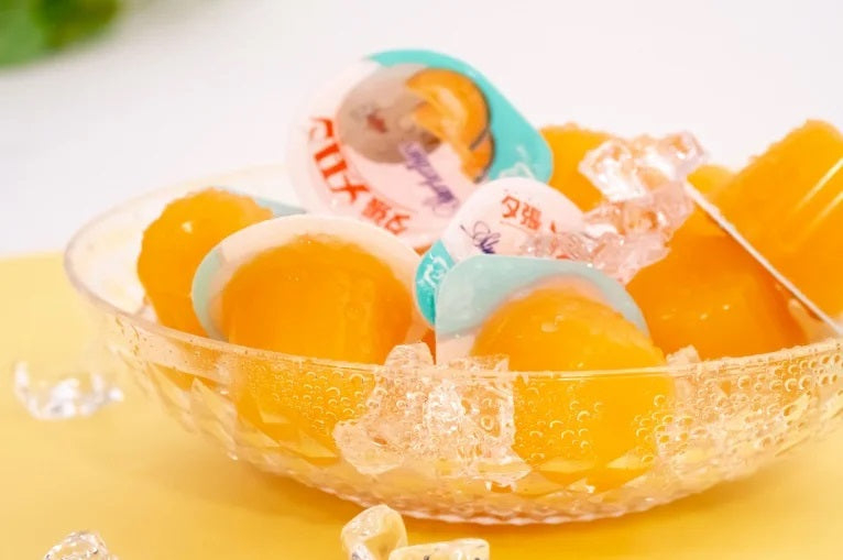 Yubari Melon Jelly Mini Box 15P in a bowl, featuring bite-size jellies perfect for souvenirs or home use, can be enjoyed frozen as sorbet.