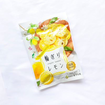 Japanese dried lemon slices package with floral design and citrus illustrations on a white background.