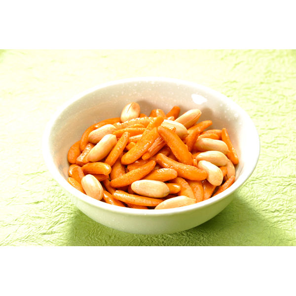 KAMEDA Kaki no Tane rice crackers and peanuts in a bowl with crispy soy sauce flavor, ideal for snacking, on a green background.