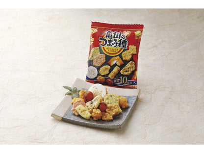 Tsumamidane Mixed Rice Cracker pack with a plate of assorted rice crackers and snacks including squid tempura, norimaki, and arare.