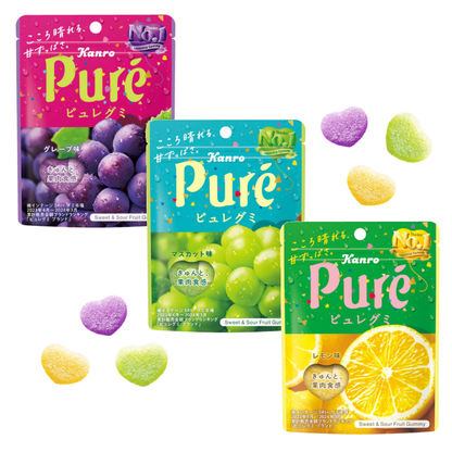 KANRO Pure Fruit Gummy packs with heart-shaped gummies; showcasing grape, muscat, and orange flavors with a sour powder coating.