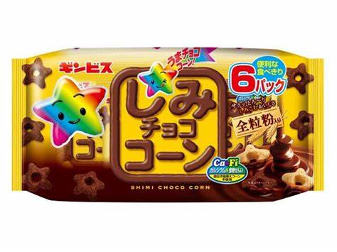 Colorful package of chocolate corn snack with whole wheat flour, featuring a star mascot and 6-pack labeling.