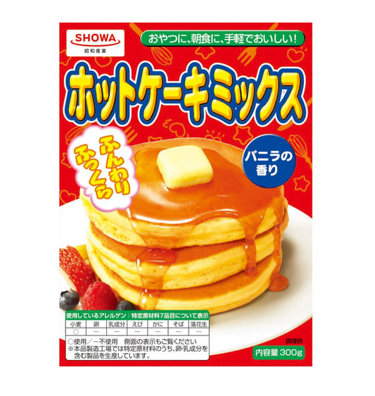 Hot Cake Mix 300g package featuring pancakes with syrup and butter, ideal for making fluffy, vanilla-scented pancakes and sweets.