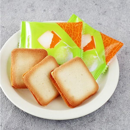 Plate of Furano Melon Cookies with colorful packaging, showcasing crisp cookies filled with high-quality melon chocolate from Hokkaido.