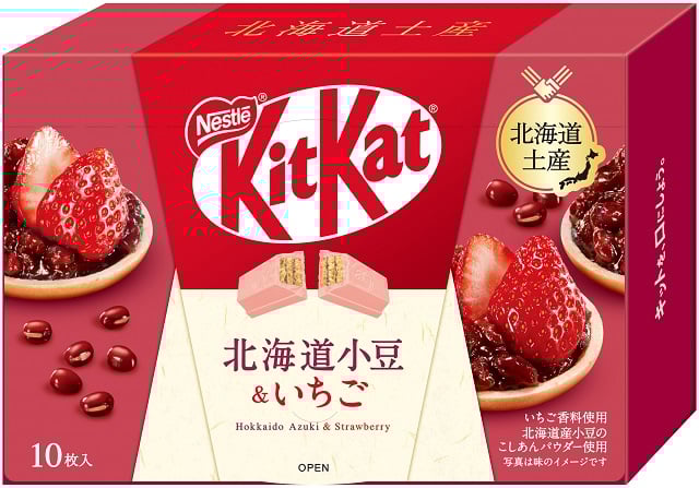 Japanese KitKat packaging featuring Hokkaido Azuki and Strawberry flavor, with Nestle logo and strawberry imagery.