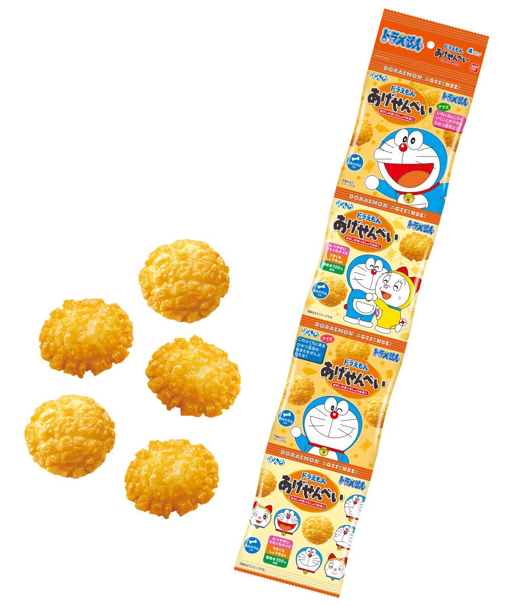 Fried rice crackers with soy sauce flavor, featuring "Doraemon" characters, made from 100% domestic rice with added calcium.