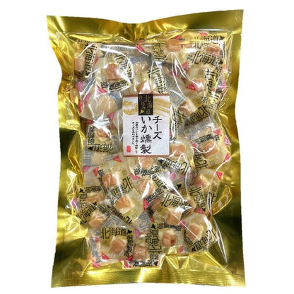 Packaged smoked squid with cheese snack, individually wrapped in a shiny gold bag. Contains dairy, squid, and gelatin.