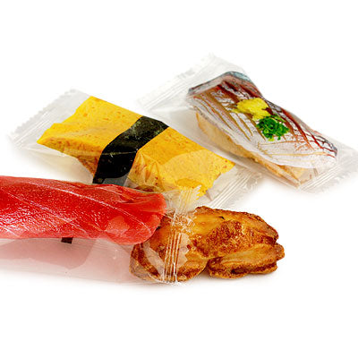 Assorted sushi rice crackers including spicy wasabi and sweet soy sauce flavors, individually wrapped for freshness.