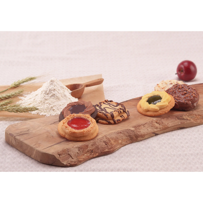 Alt Tag: Assorted baked cookies with chocolate and fruit jam decoration, on a rustic wooden board, evoking nostalgia and homemade charm.