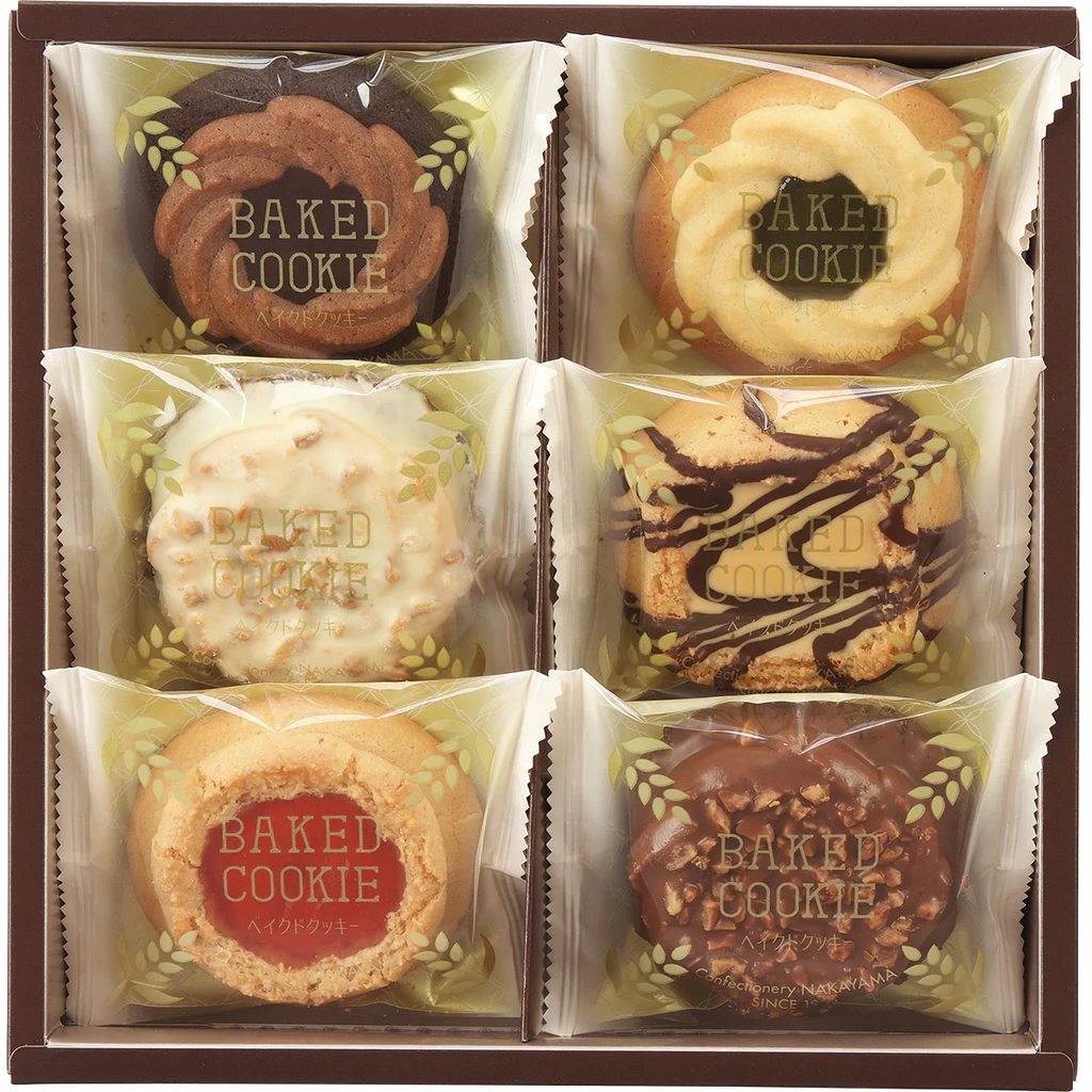 Assorted baked cookies with chocolate and fruit jam in rustic packaging, suitable for gifting; contains common allergens.
