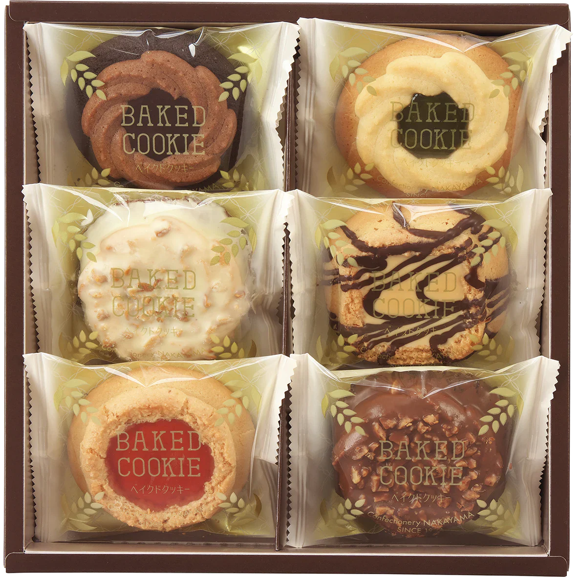 Assorted baked cookies with chocolate and fruit jam in rustic packaging, suitable for gifting; contains common allergens.