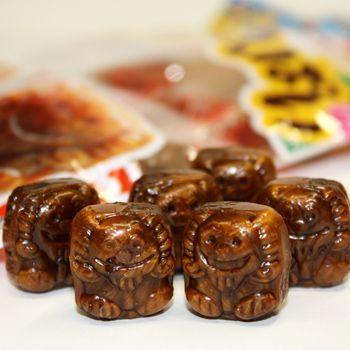 Okinawa Brown Sugar Candy shaped like Shisa lions, highlighting unique design and sweet flavor.