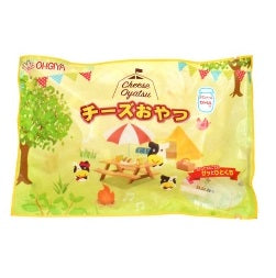 Packaging of Cheese Oyatsu Camembert 218g with colorful outdoor picnic illustration.