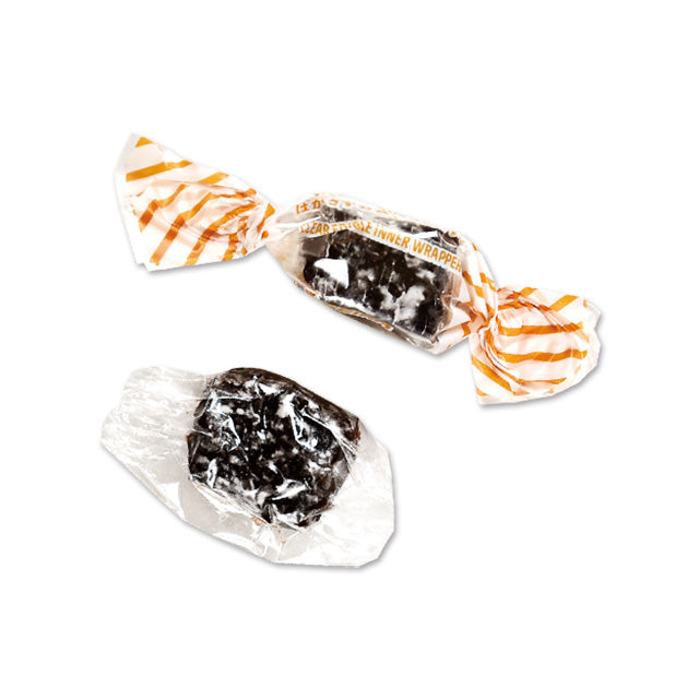 Chocolate mochi soft candy with sticky, elastic texture, wrapped in packaging. Contains dairy and soybean allergens.