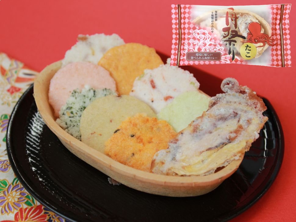 Assorted SUGI Funamatsuri Fish Rice Crackers in an edible tray, featuring shrimp and octopus flavors, with packaging backdrop.