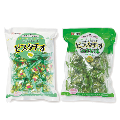 Two packs of Green Snack Pistachio, plain and wasabi flavored, in green packaging, showcasing shelled pistachios in crispy batter.
