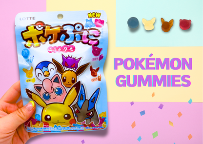 Hand holding a pack of Pokémon gummies with colorful characters like Pikachu on a pastel background.